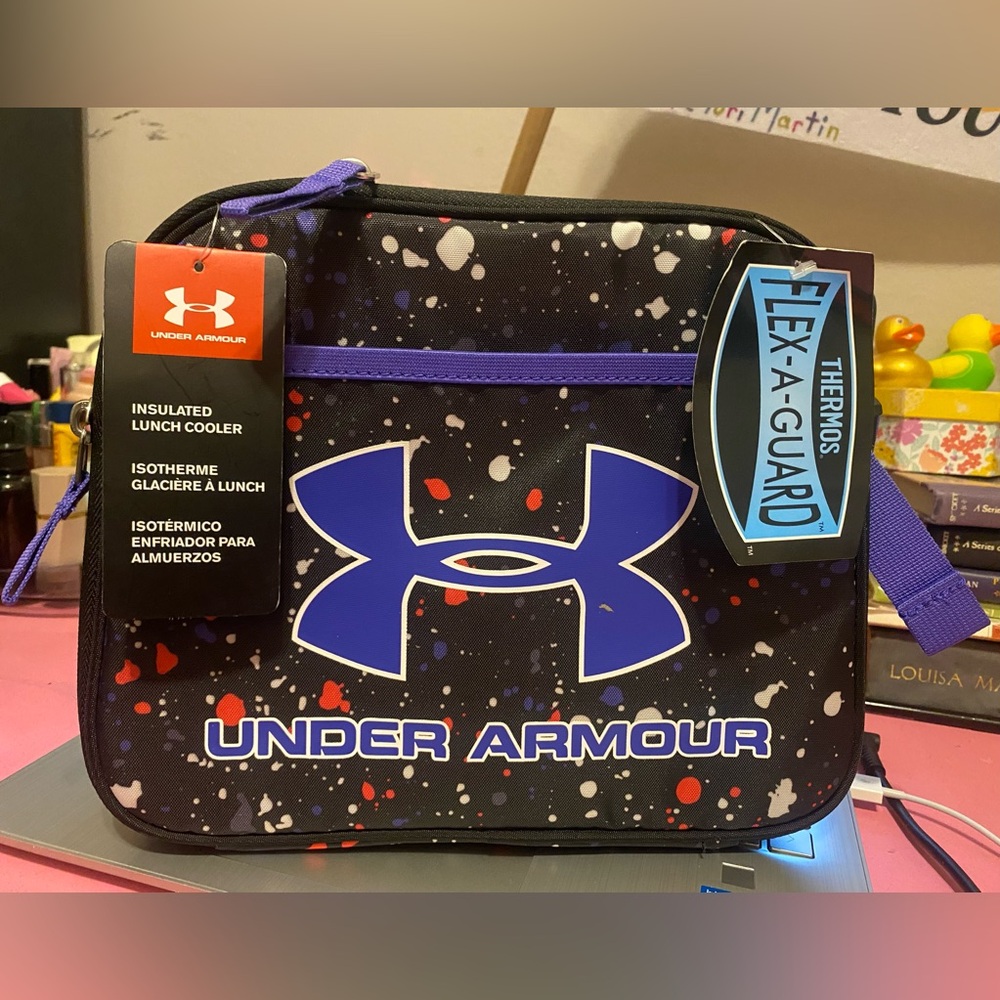 NWT, Under Armor UA Reinforced Soft
Cooler Black Purple Paint Splatter